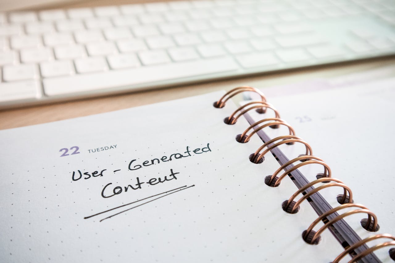 Notebook with user-generated content note and keyboard, ideal for planning and productivity.